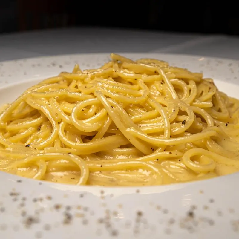 Spaghetti cacio e pepe with cracked pepper and parmigiano at Chef's Roma Kitchen